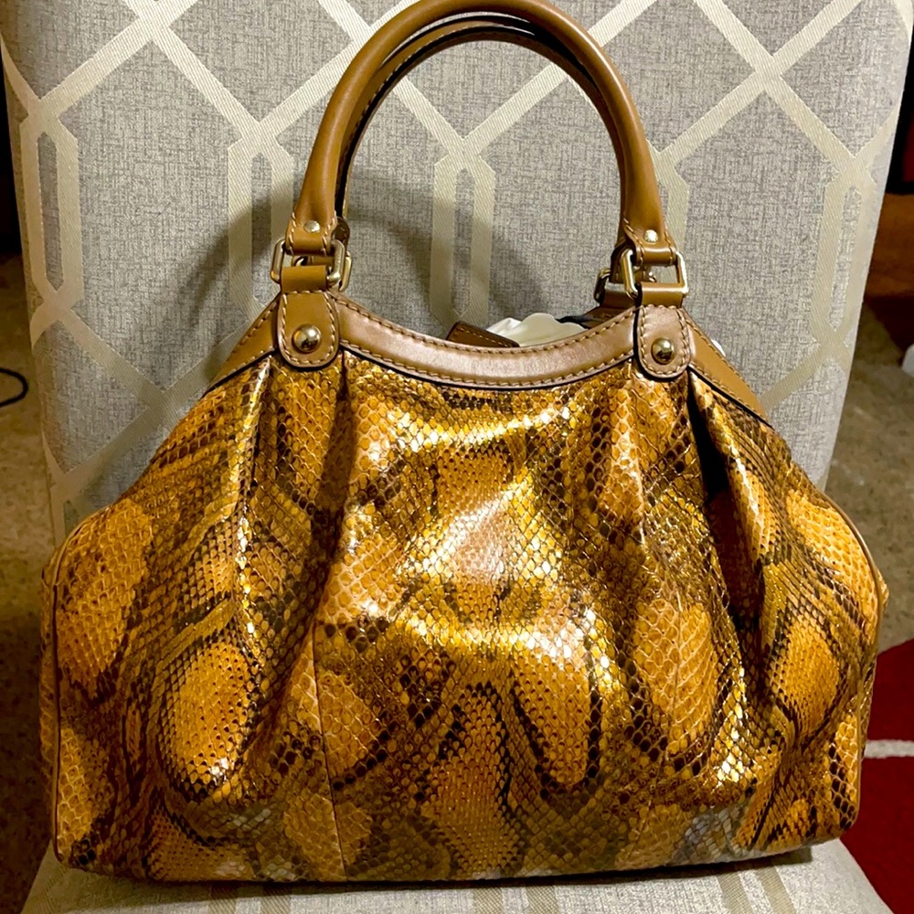 Gucci Sukey Python in excellent new condition.